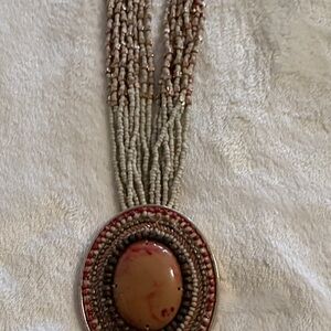 Elegant Beaded Necklace with Oval Pendant